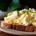 Healthy egg salad with cottage cheese, no mayo, served in a bowl.
